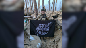 Олександр із прапором в руках