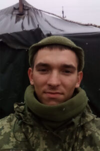 Біля палатки